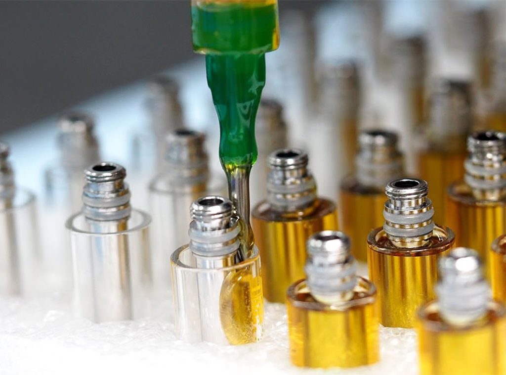 Syringe Filling Dab Cartridges in Tray